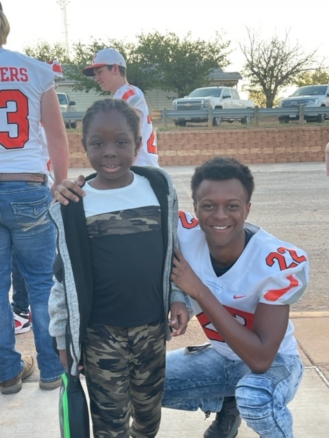 Jordan with elementary student at drop off